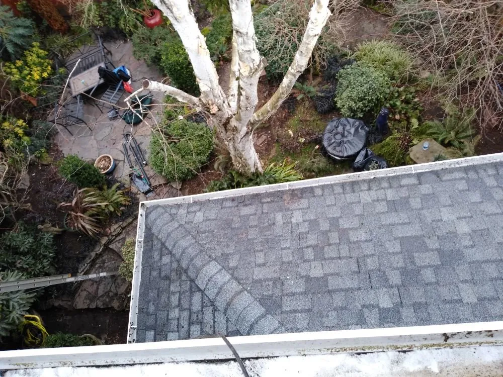 Slide of Charity's Roof and Gutter Cleaning