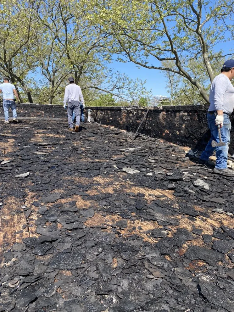 Slide of Charlie's Expert Roofing