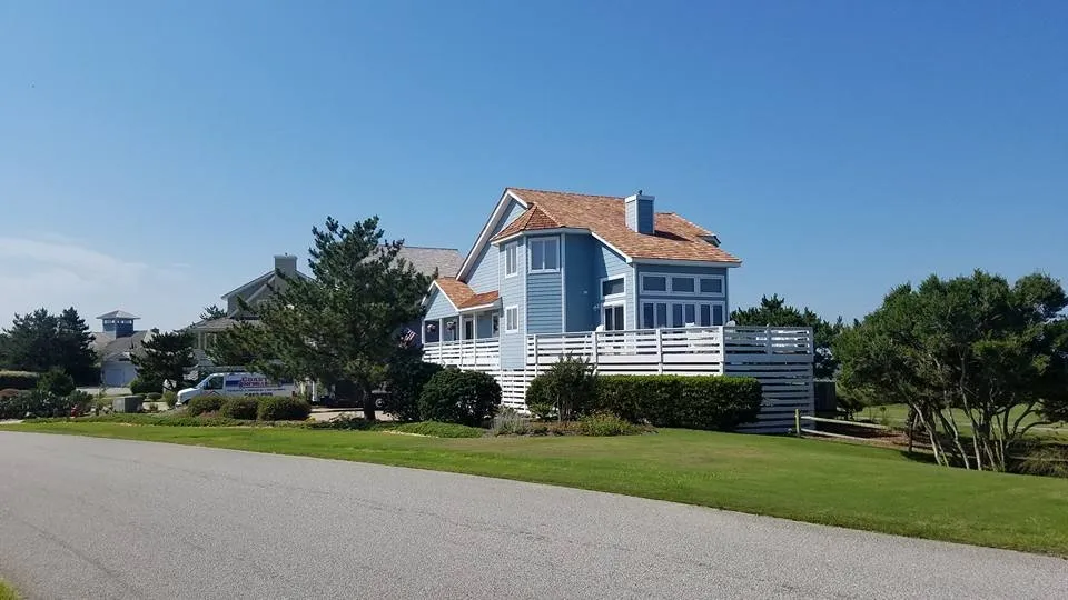 Licensed storm damage roof repair in Powells Point, NC by Coastal Roofing & Siding