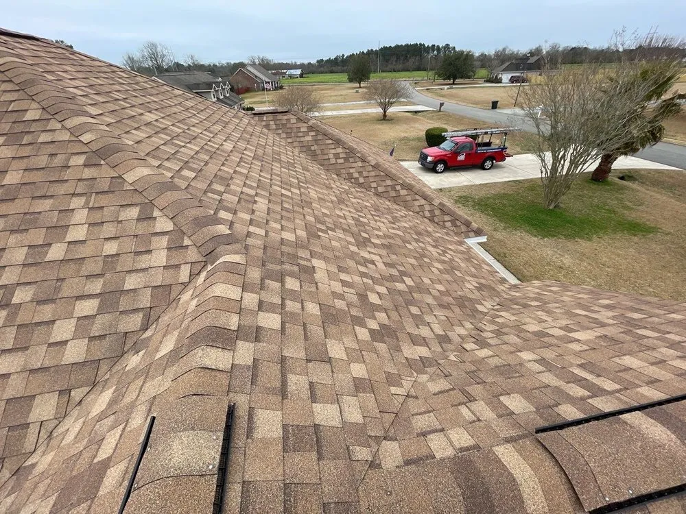 Slide of Coastal Roofing