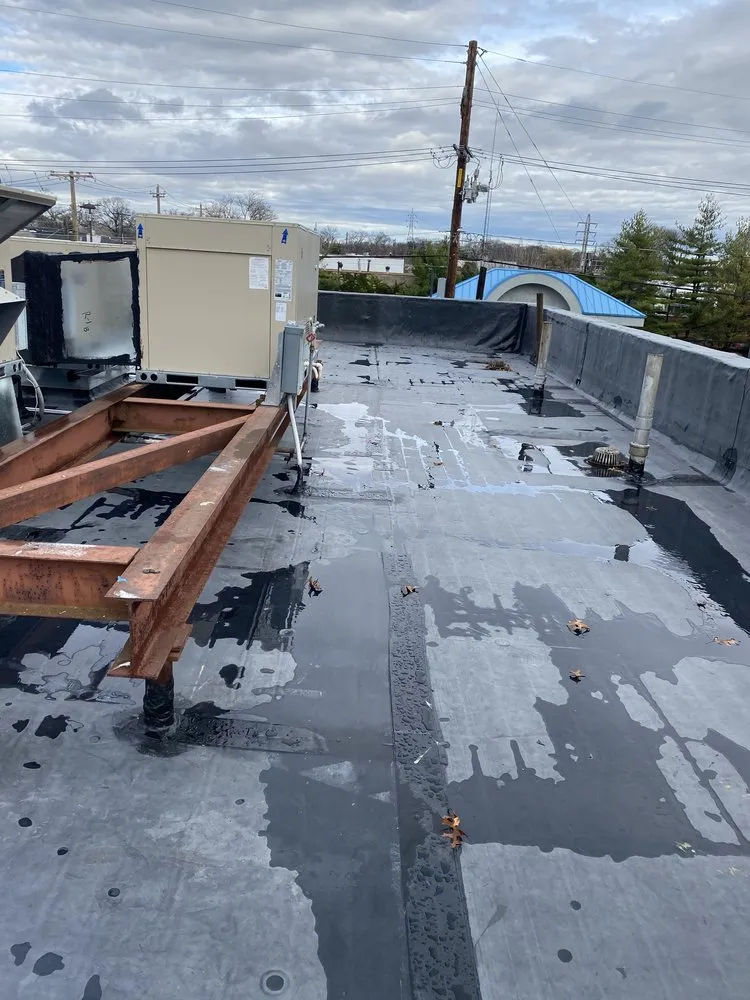 Local flat roof repair for homes in Amityville, CT by Commercial Roofing Solutions