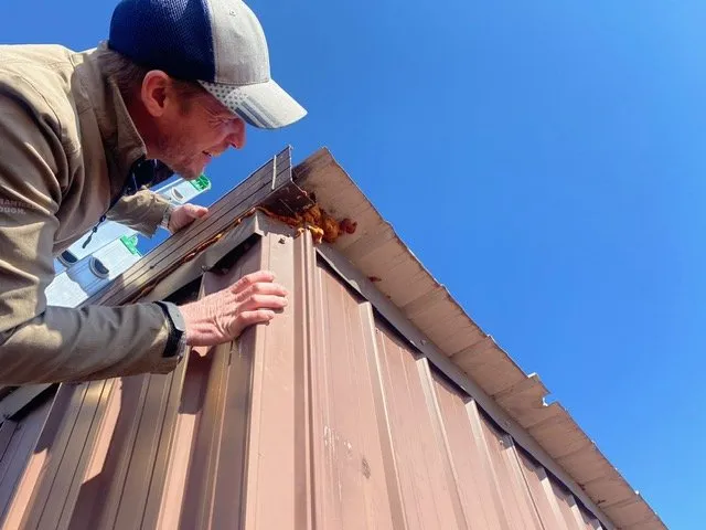 Professional roof inspection after storm damage in Louiseville, KY by Commonwealth Roofing