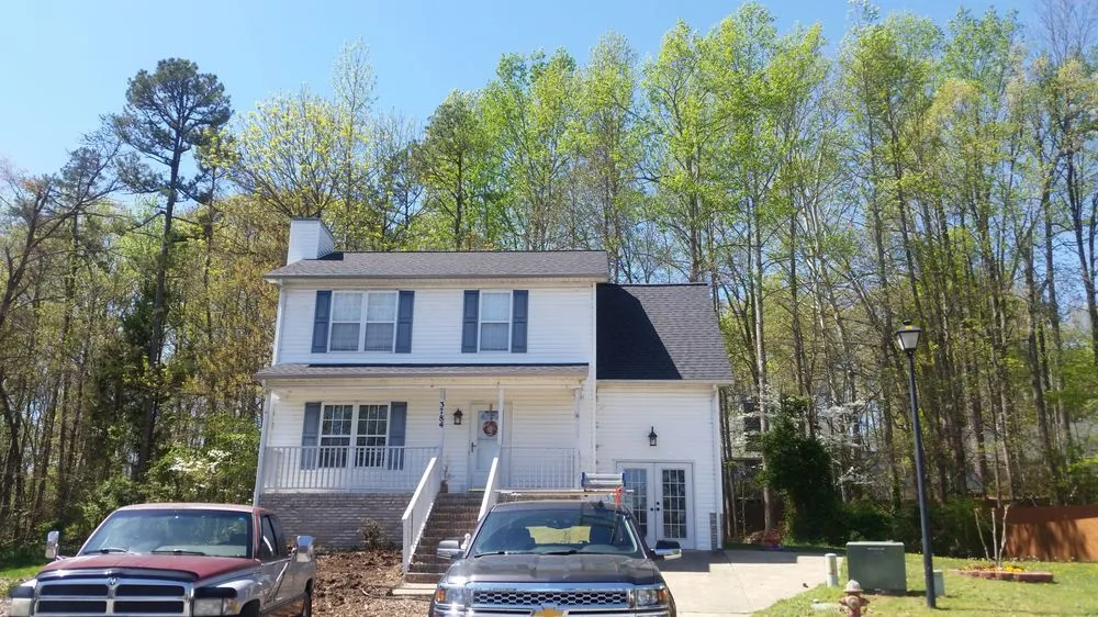 Slide of Compass Roofing and Renovations