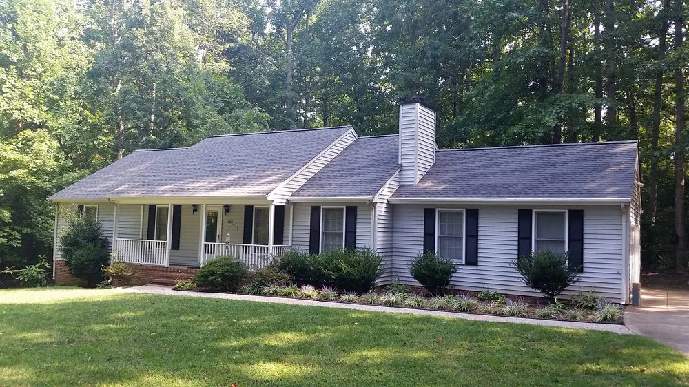 Slide of Compass Roofing and Renovations