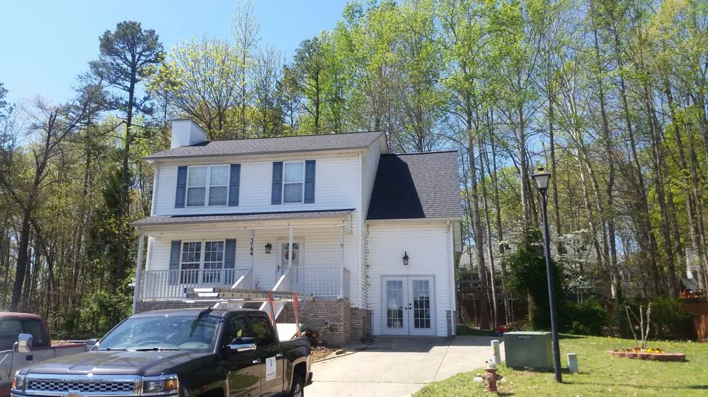 Slide of Compass Roofing and Renovations