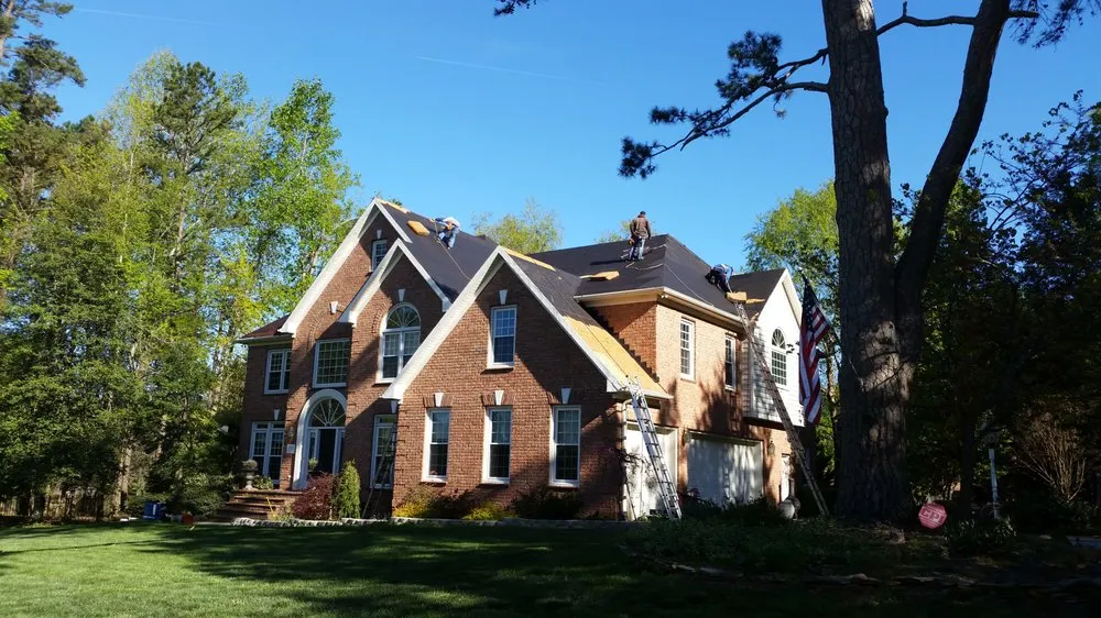 Slide of Compass Roofing and Renovations