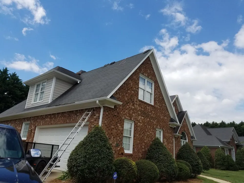 Slide of Compass Roofing and Renovations