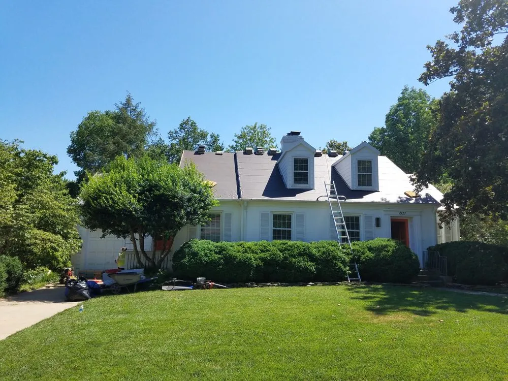 Slide of Compass Roofing and Renovations