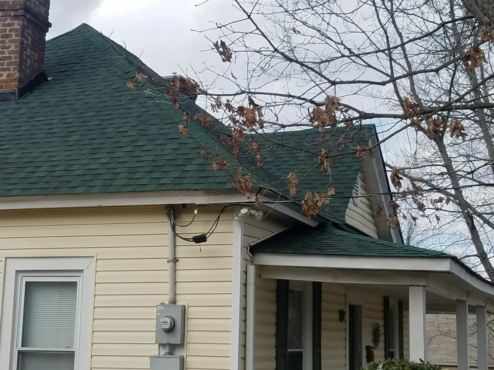 Slide of Compass Roofing and Renovations