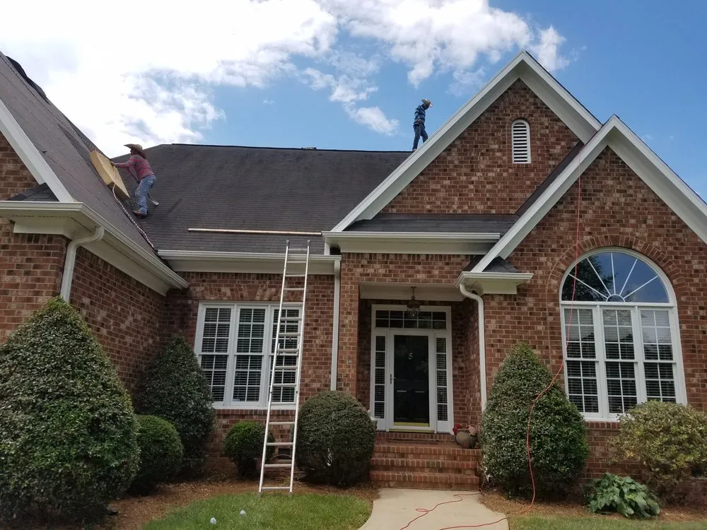 Slide of Compass Roofing and Renovations