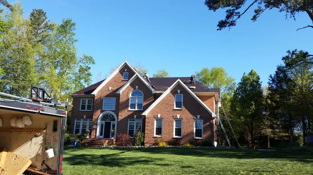 Slide of Compass Roofing and Renovations