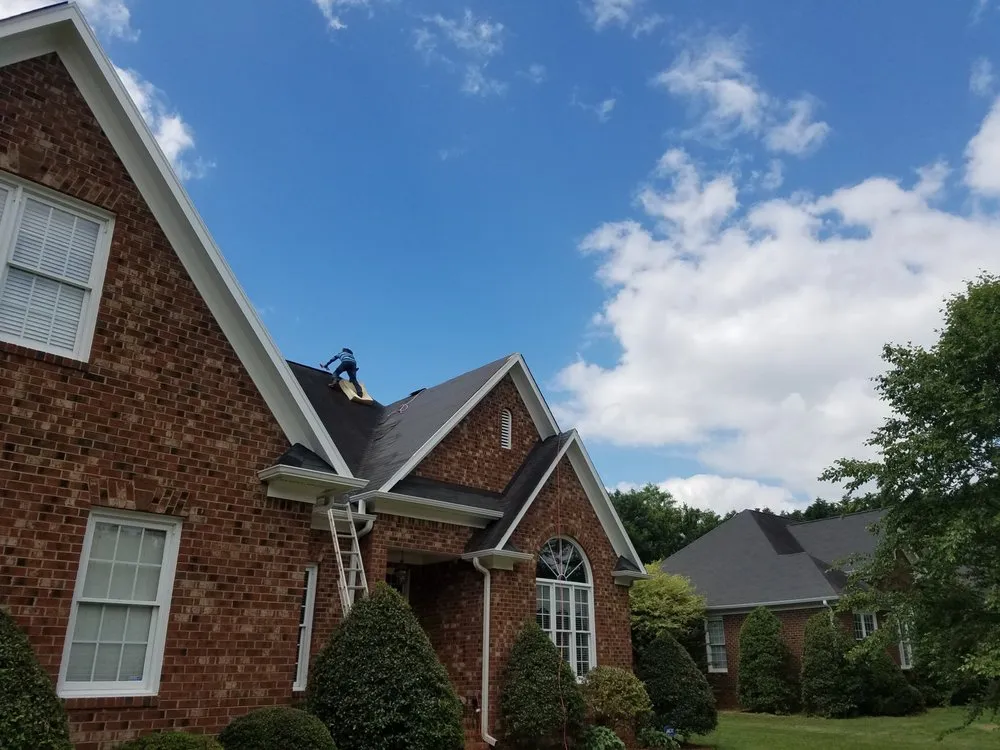 Slide of Compass Roofing and Renovations