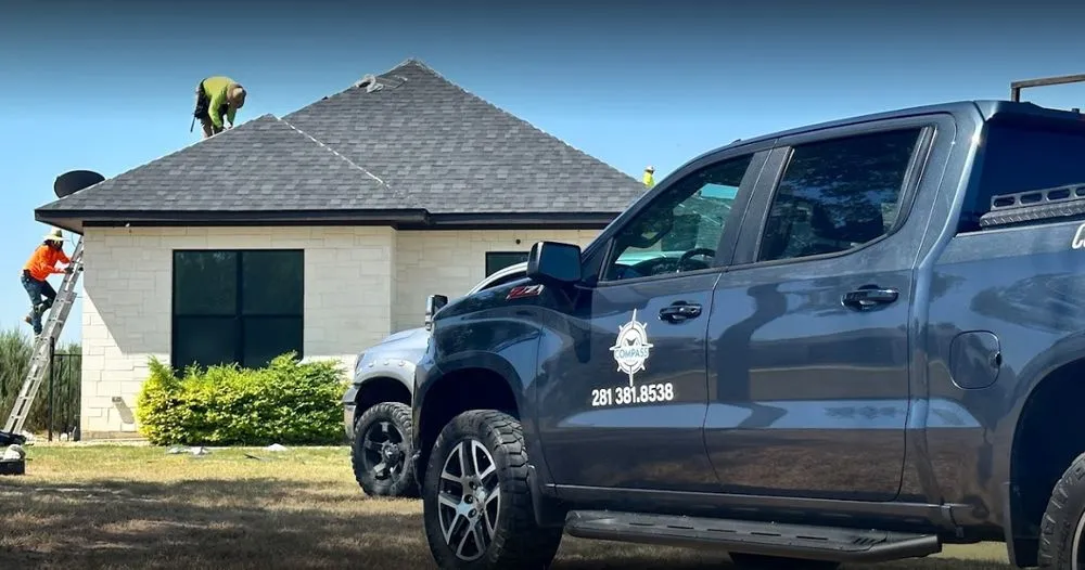 Slide of Compass Roofing