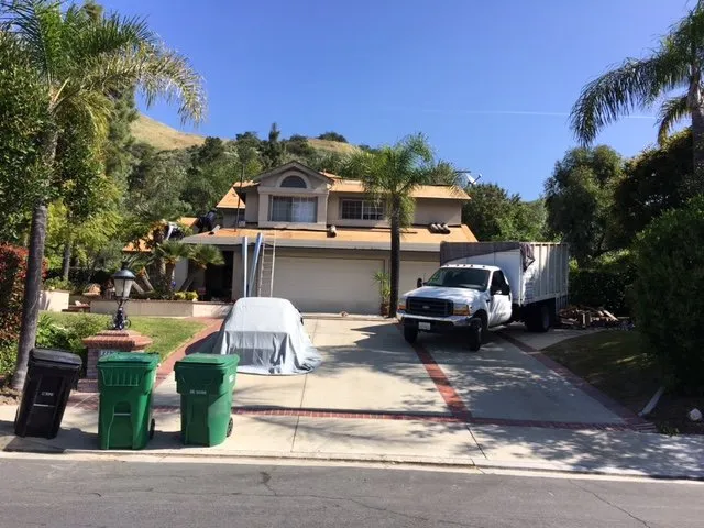 Slide of Competition Roofing