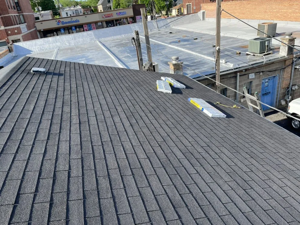 Slide of Competitive Shingle & Flat Roofing