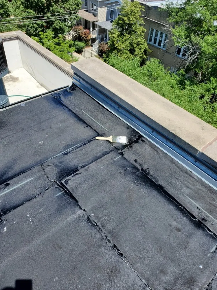 Slide of Competitive Shingle & Flat Roofing