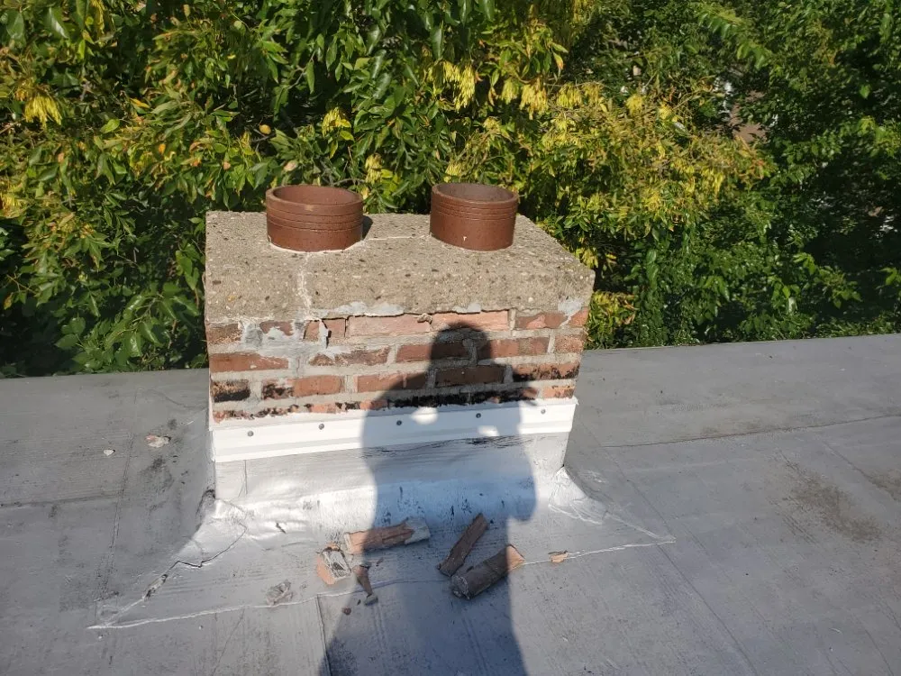 Slide of Competitive Shingle & Flat Roofing