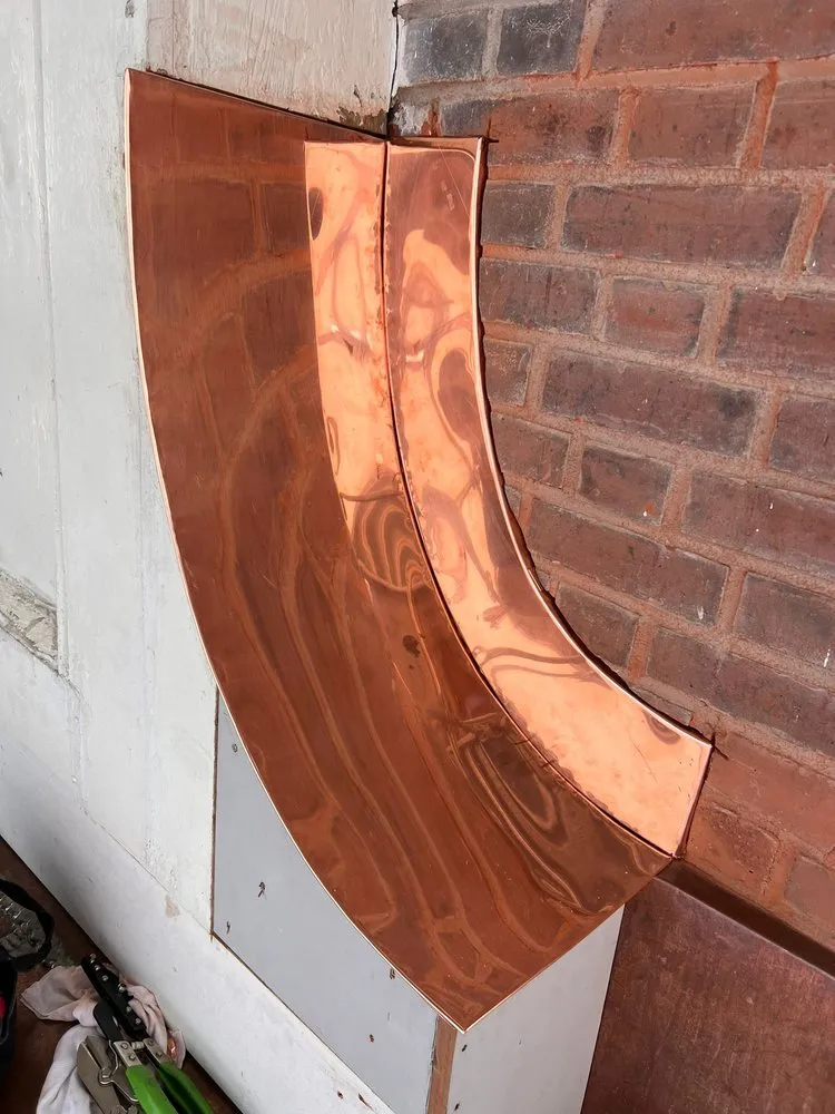 Slide of Copper Slate & Cedar Roofing