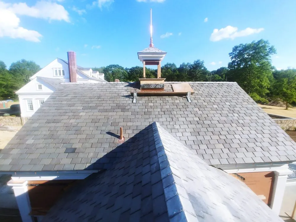 Slide of Copper Slate & Cedar Roofing