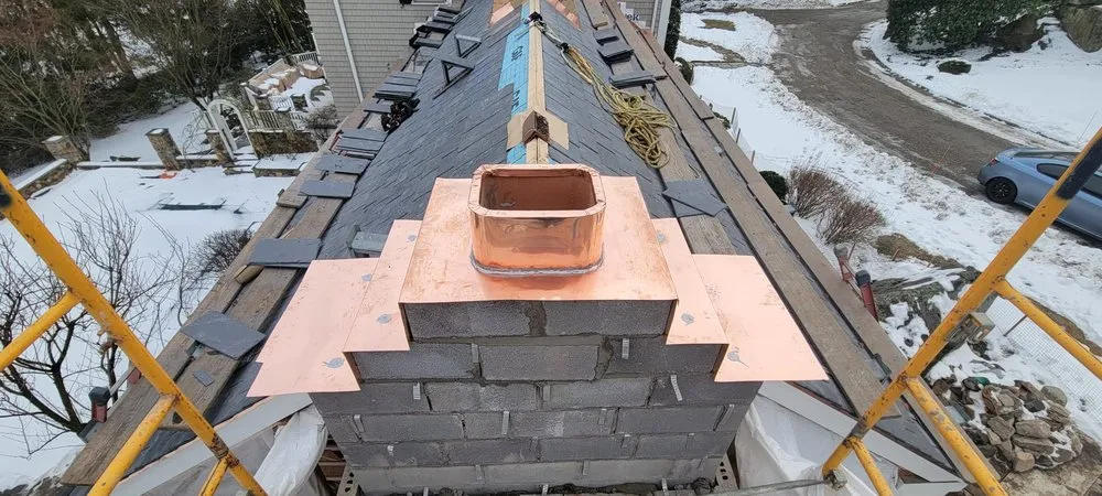 Slide of Copper Slate & Cedar Roofing