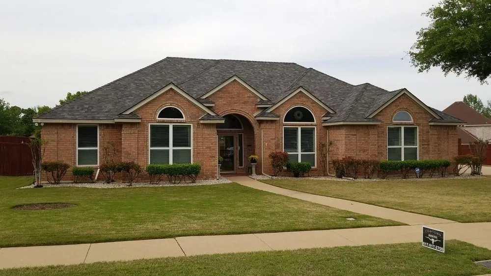 Slide of Cowtown Roofing