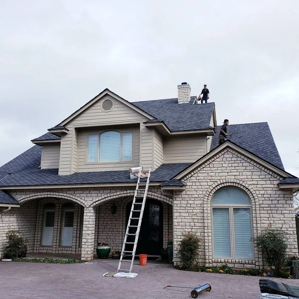 Slide of Cowtown Roofing