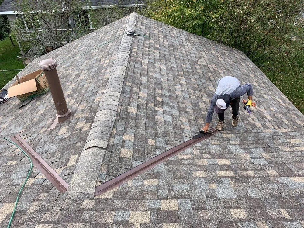 Slide of DE AL Roofing