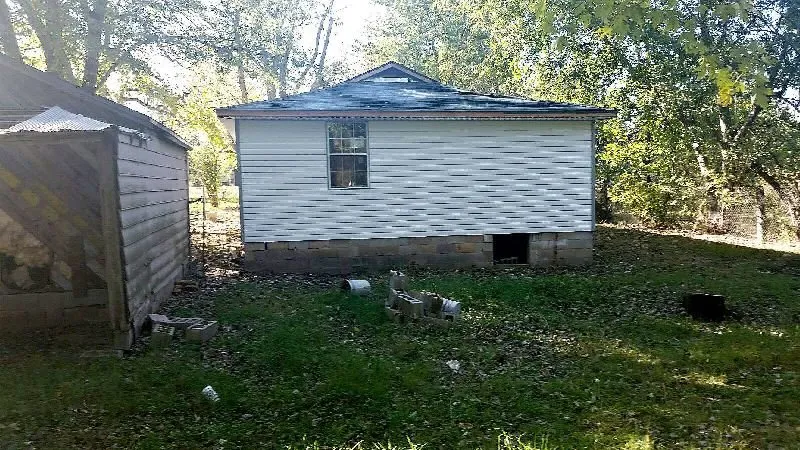 Slide of De La Cruz Roofing