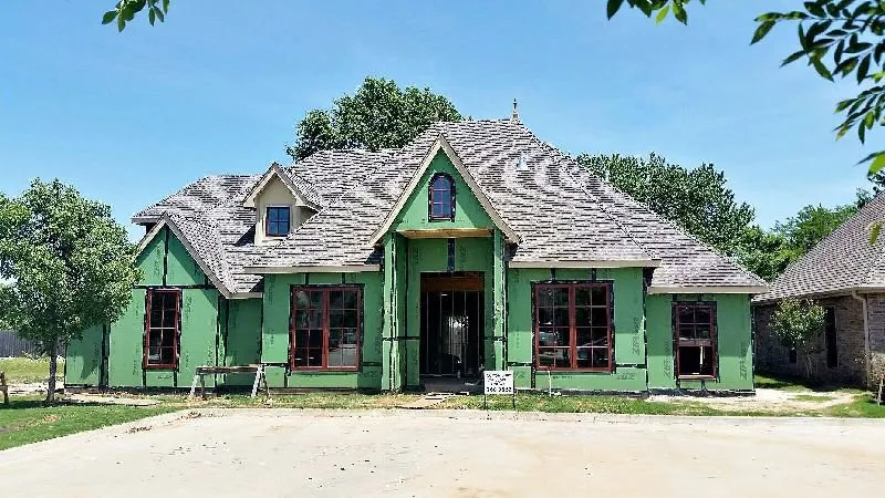 Slide of De La Cruz Roofing