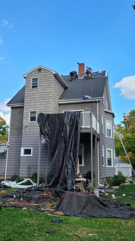 Slide of De La Rosa Roofing