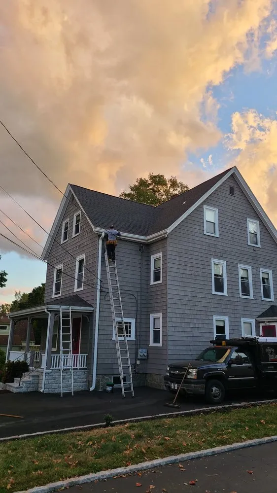 Slide of De La Rosa Roofing