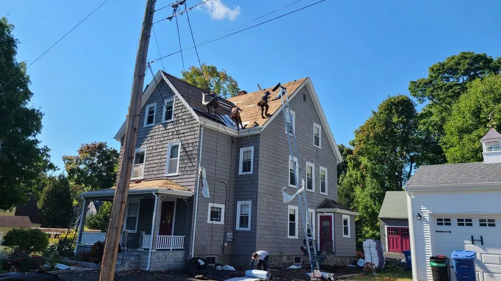 Slide of De La Rosa Roofing