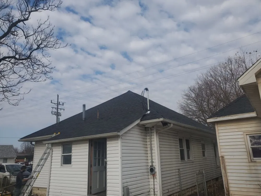 Slide of De Los Santos Roofing and Construction