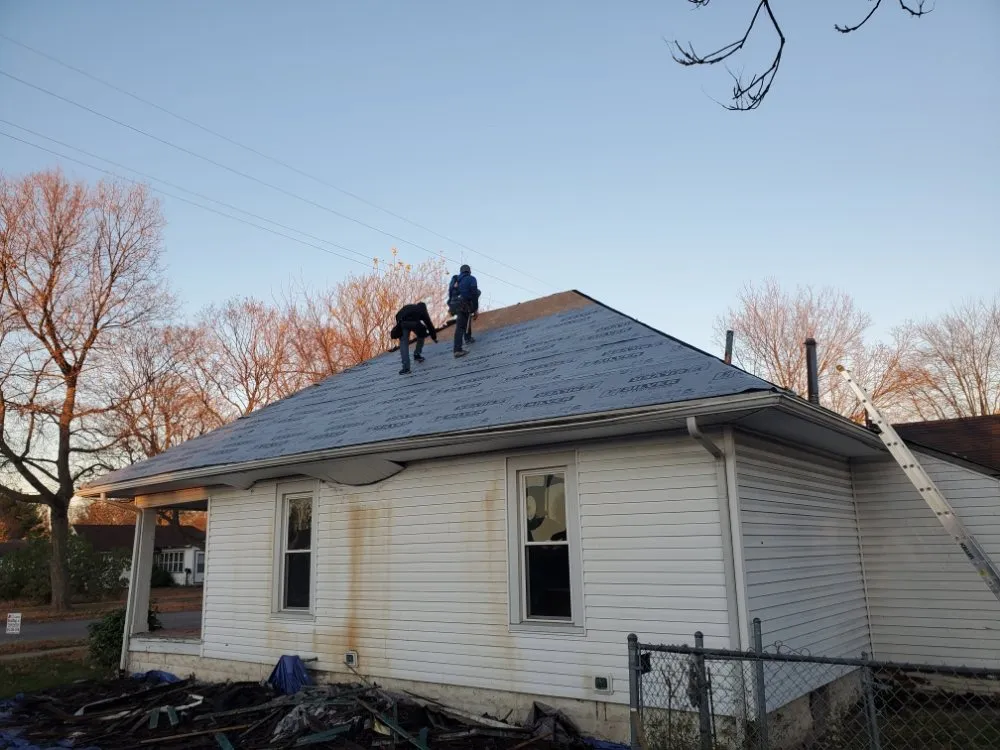 Slide of De Los Santos Roofing and Construction