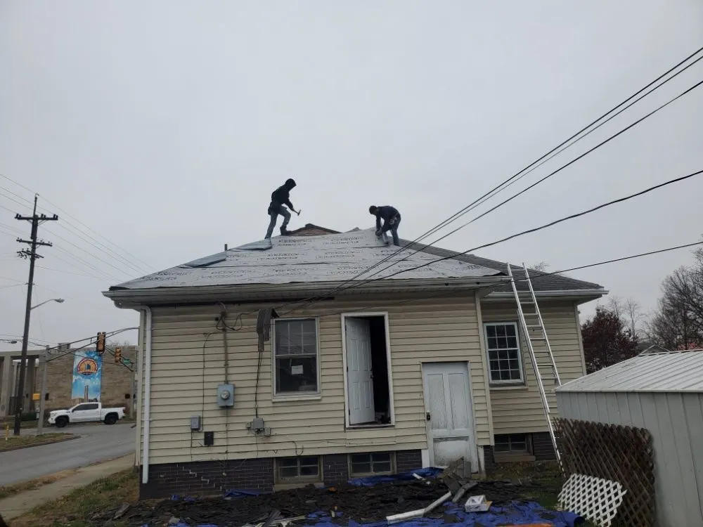 Slide of De Los Santos Roofing and Construction