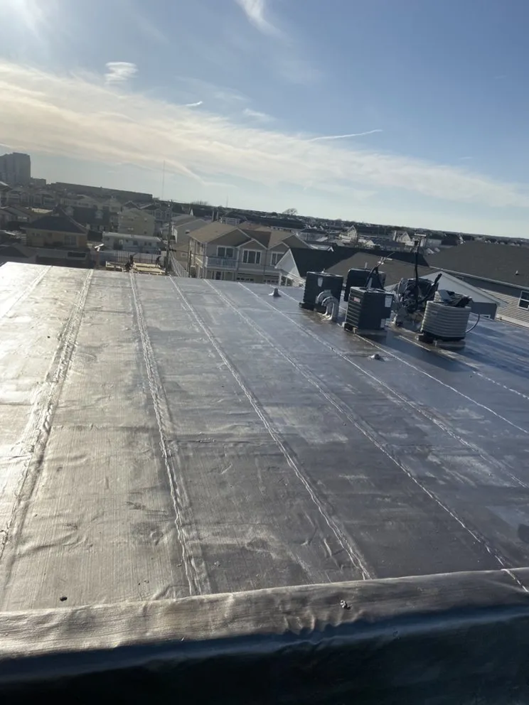 Slide of Deans Roofing and Paving