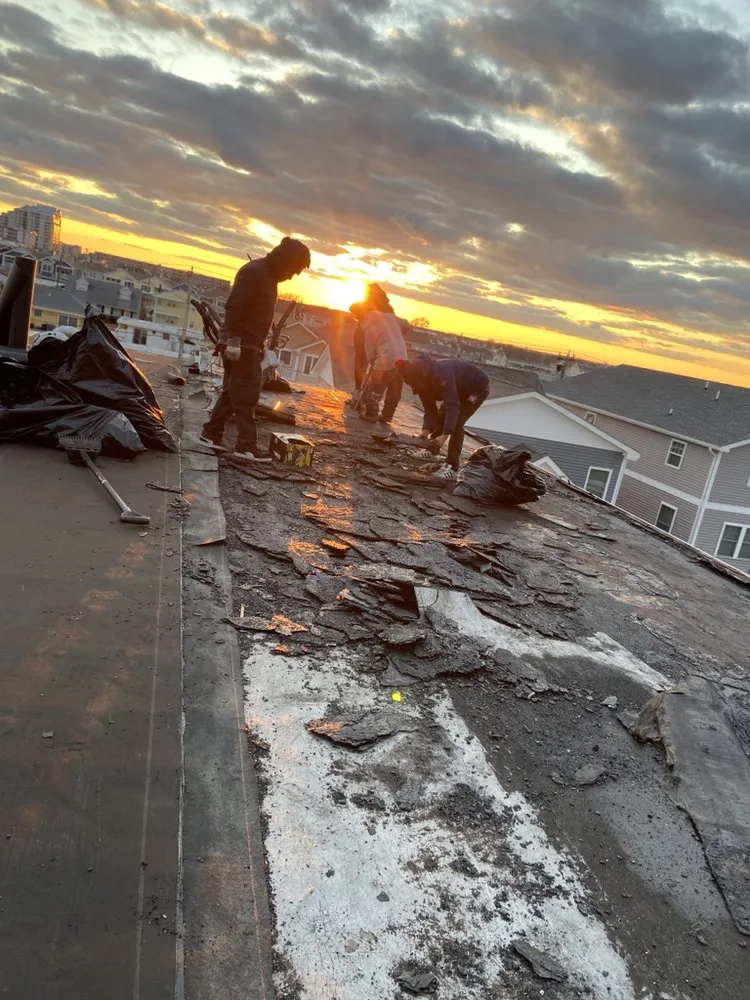 Slide of Deans Roofing and Paving