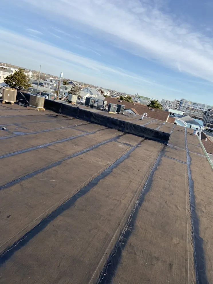 Slide of Deans Roofing and Paving