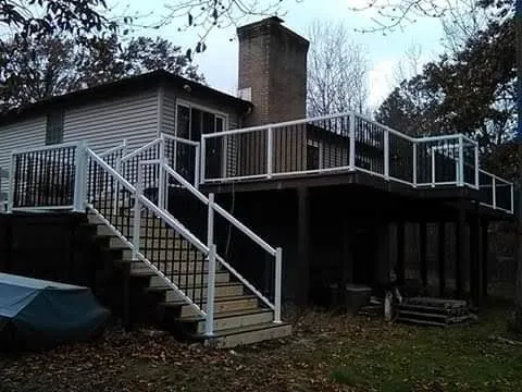 Emergency flat roof repair for homes in Morley, MI by Deck and Design by Wood