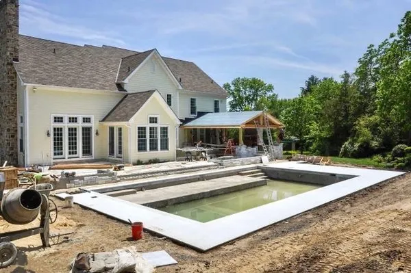 Dedicated Roofing And Masonry Logo