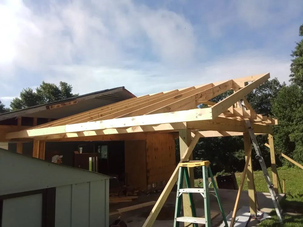 Slide of Dee's Roofing and Seamless Gutters