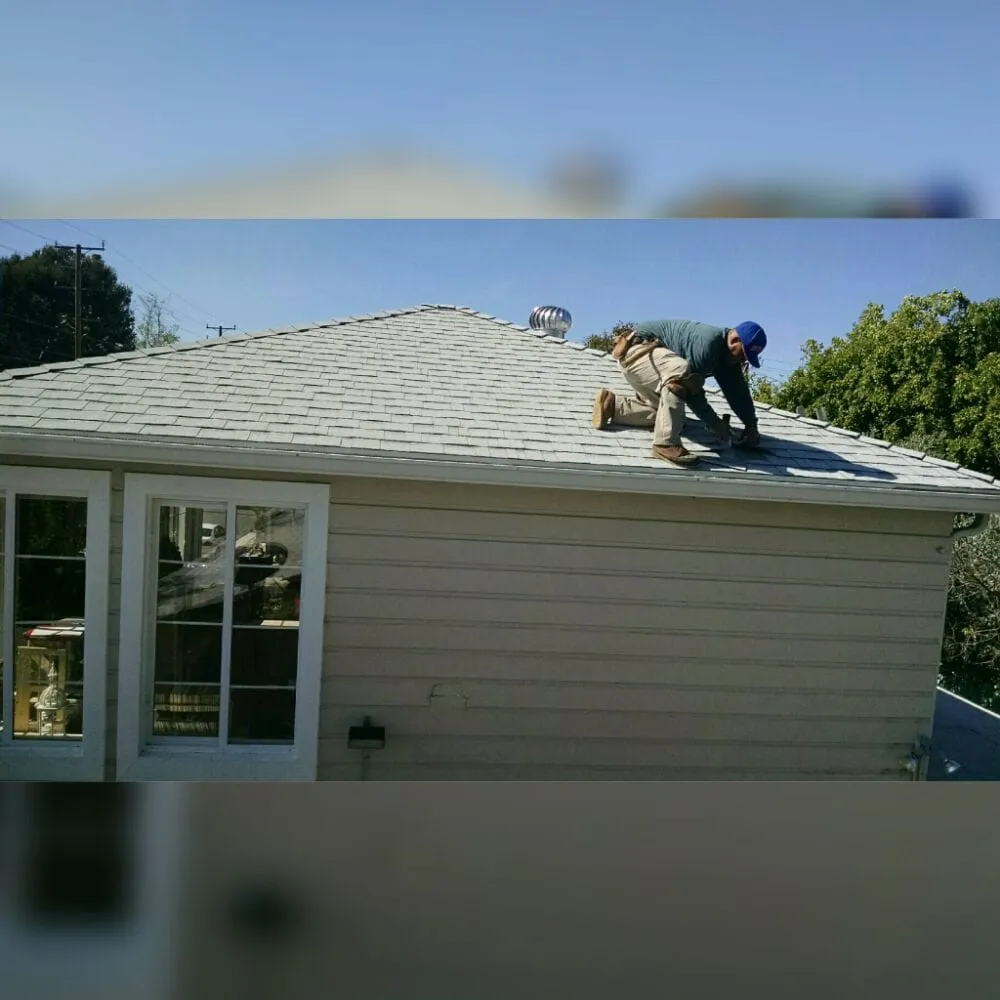 Slide of Delcid Roofing