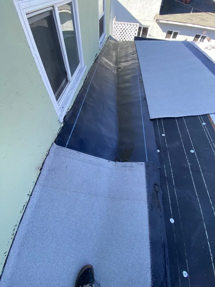 Slide of Delino’s Roofing & Remodeling