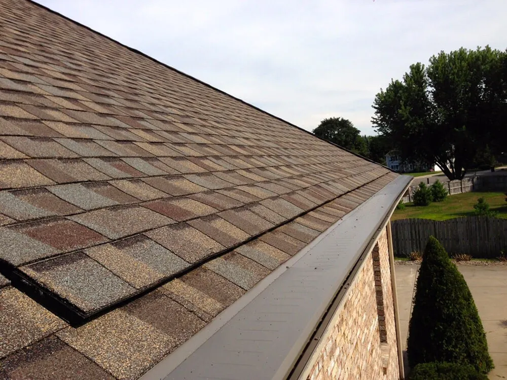 Slide of Dennison Roofing & Gutter Toppers