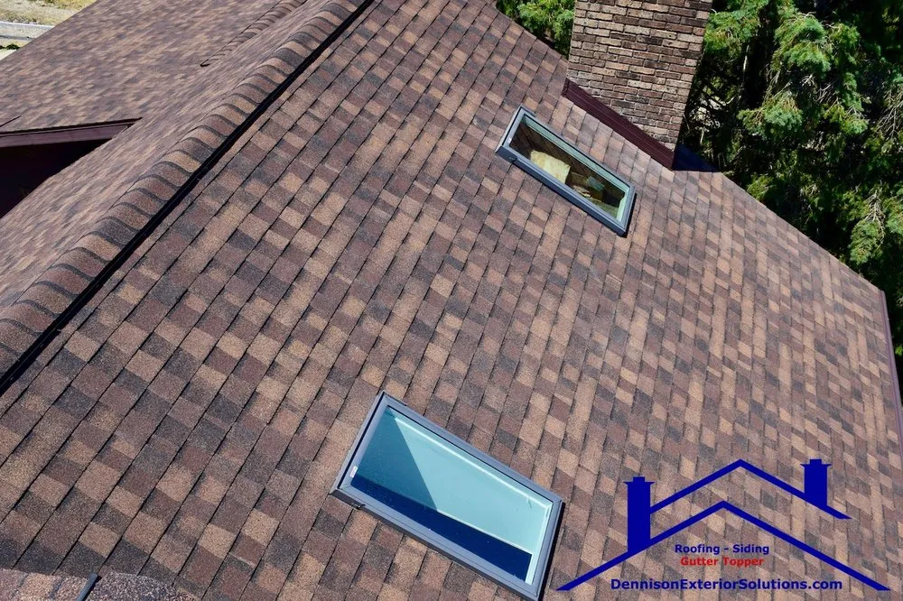 Slide of Dennison Roofing & Gutter Toppers