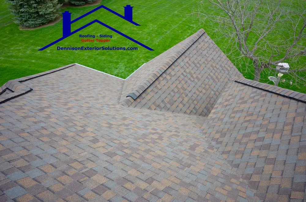 Slide of Dennison Roofing & Gutter Toppers