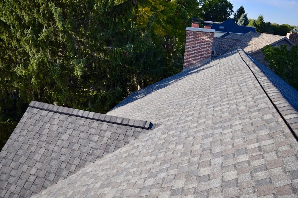 Slide of Dennison Roofing & Gutter Toppers