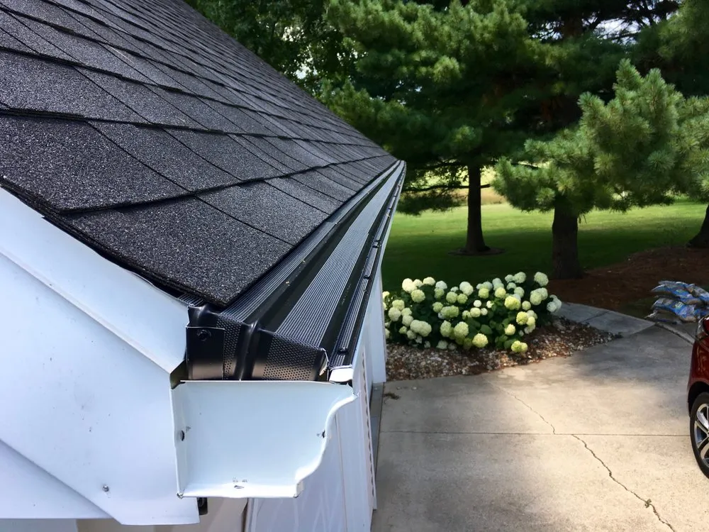 Slide of Dennison Roofing & Gutter Toppers