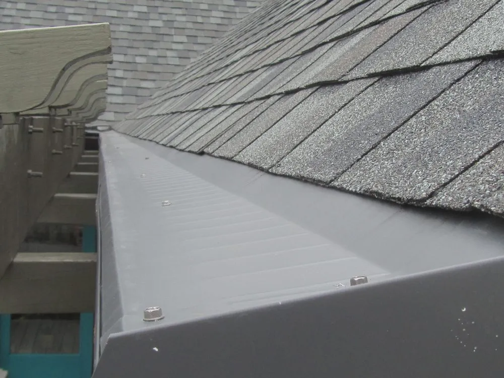 Slide of Dennison Roofing & Gutter Toppers