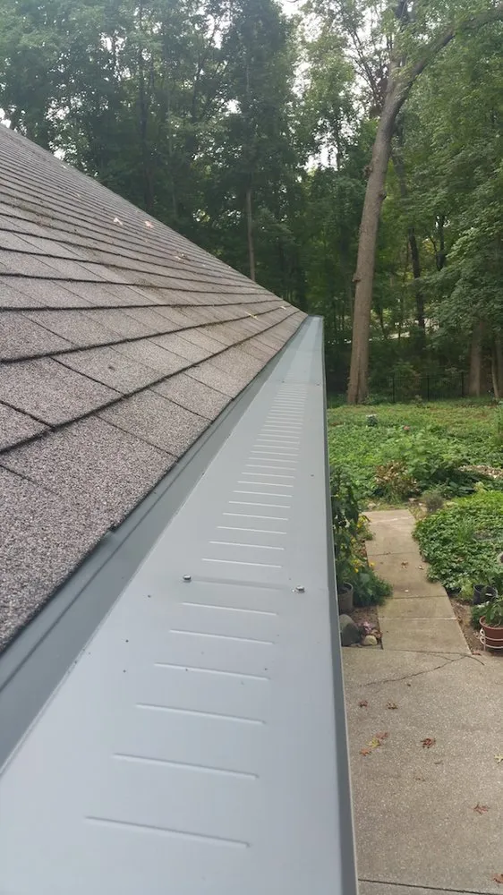 Slide of Dennison Roofing & Gutter Toppers